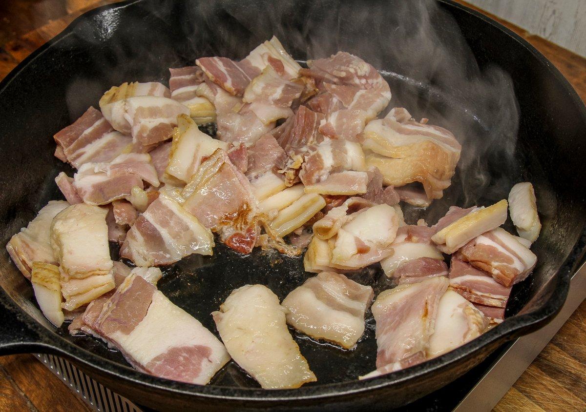 Cut the bacon into small pieces and cook until crisp.
