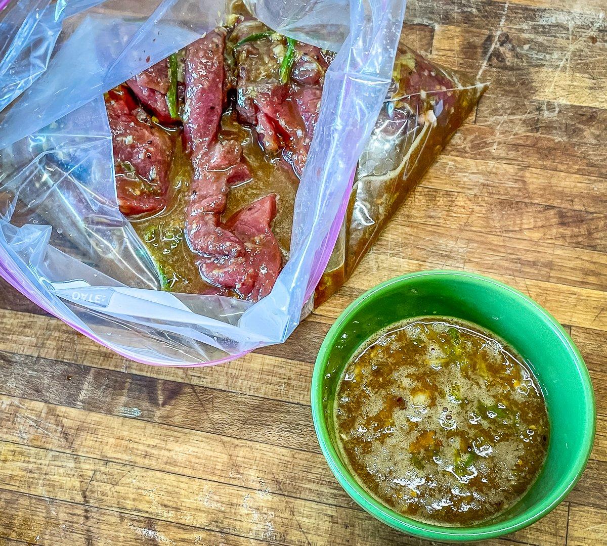 Pour part of the marinade over the meat and reserve the rest for a cooking sauce.