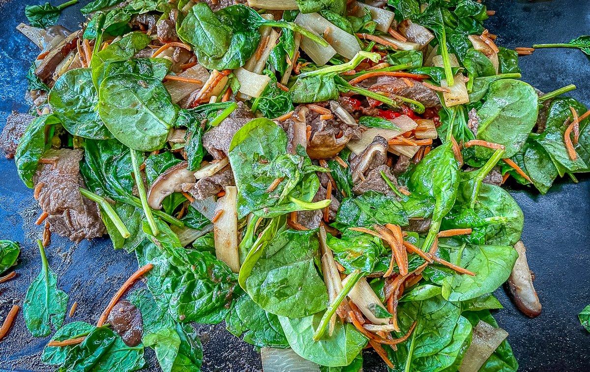 Add the spinach and bamboo shoots near the end of the cooking process.