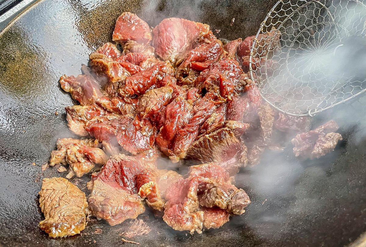 Stir fry the meat in batches to evenly brown it on all sides.