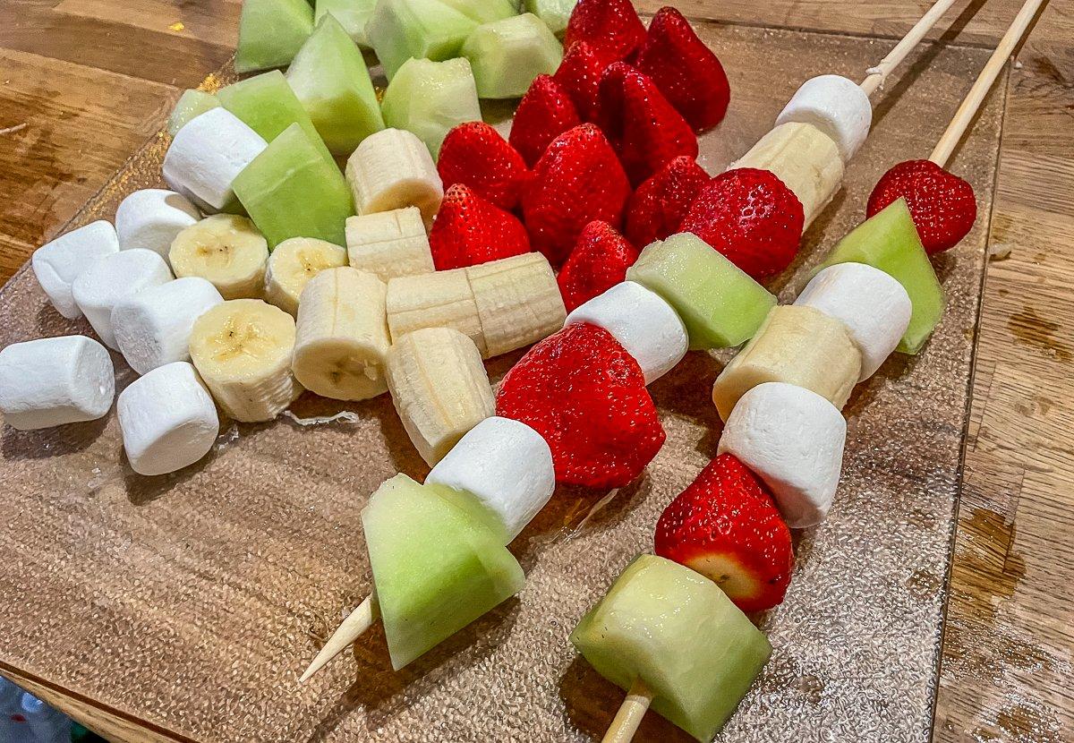 Set out fruit and marshmallows and let everyone choose their own mixture.