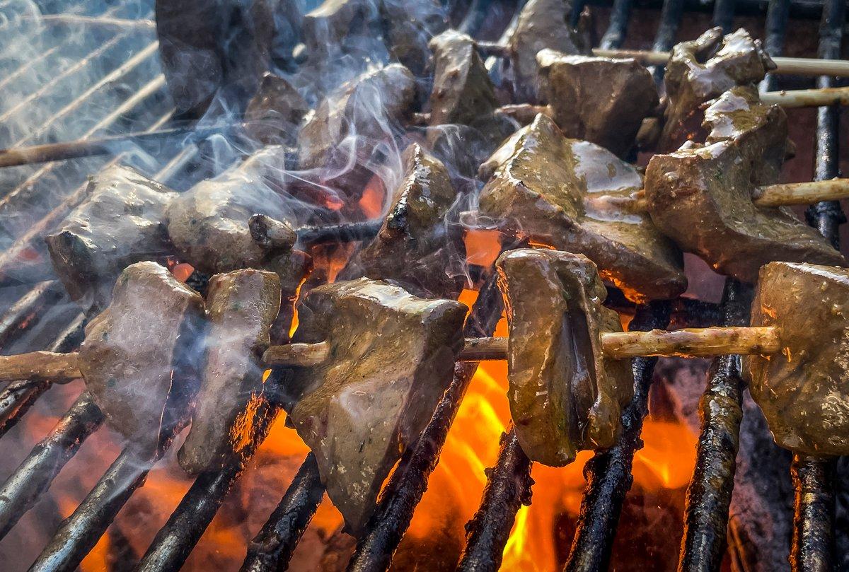 Grill the anticuchos hot and fast over a bed of coals.