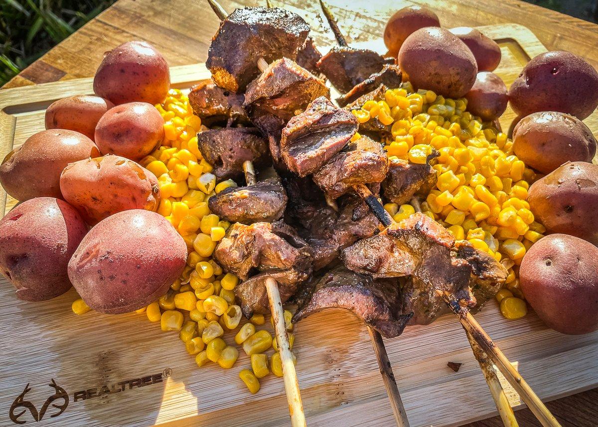 Anticuchos are traditionally served with some type of corn along with boiled potatoes.
