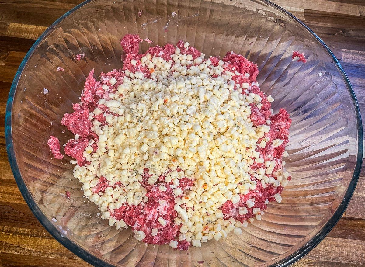 Blend the high temperature cheese into the ground venison.