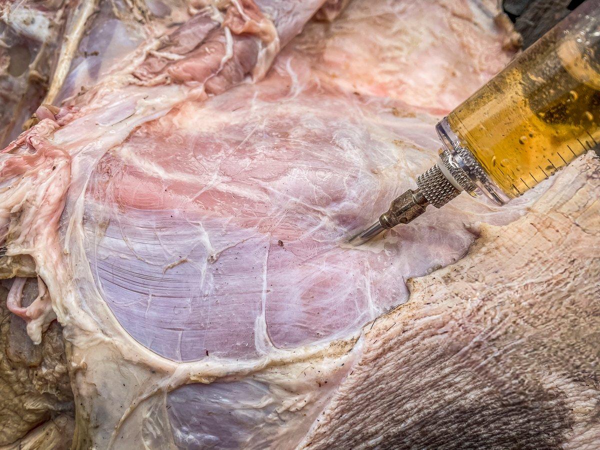 Inject fruit juice throughout the meat before roasting.