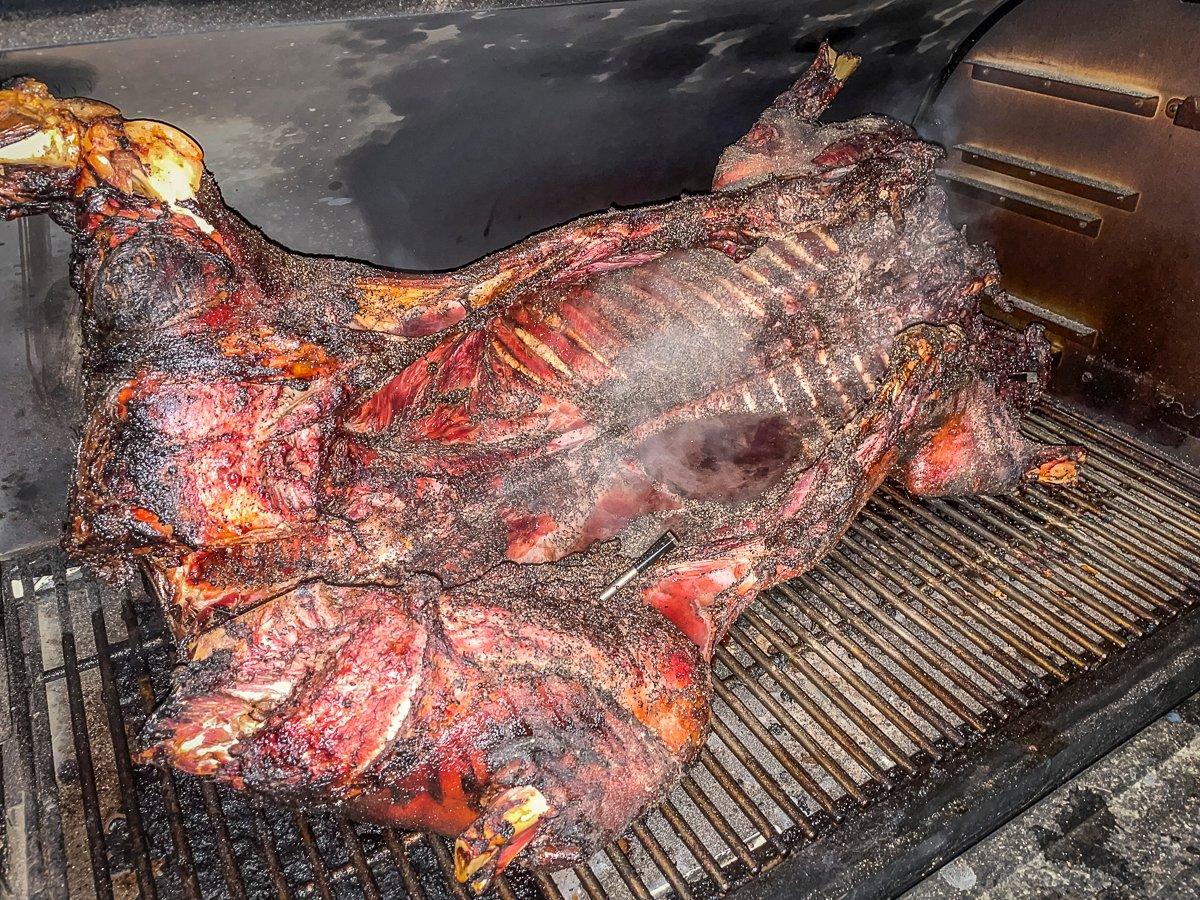 Flip the pig over to finish the cooking process.