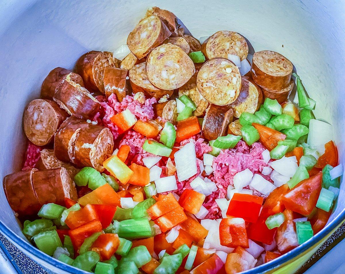 Add the venison, vegetables and peppers to the pot to brown.