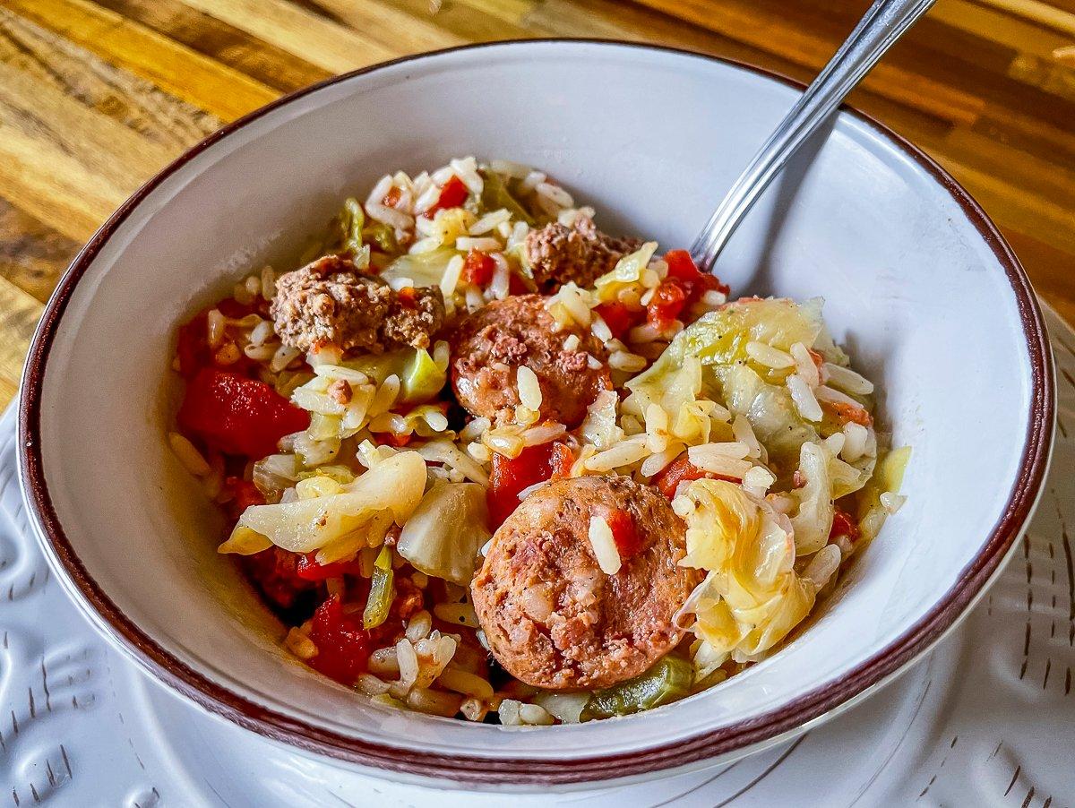 This quick and easy jambalaya style dish features venison, smoked sausage and cabbage.