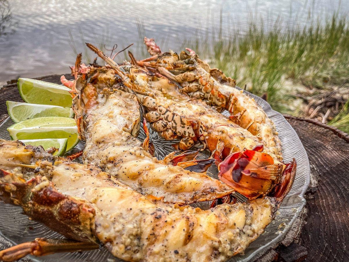 These grilled Florida spiny lobsters are packed full of smoky, buttery garlic flavor with a hint of lime.