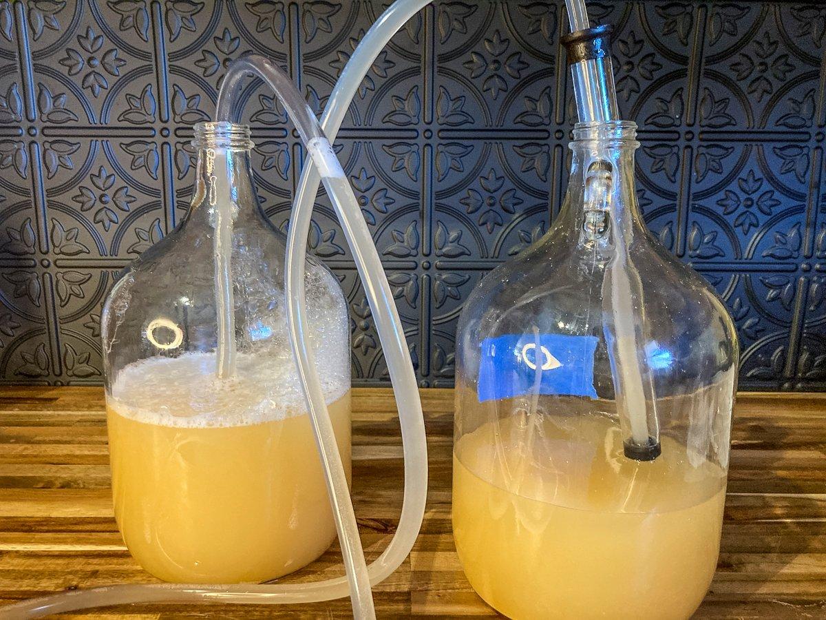 A siphon system makes racking the mead from one container to another simple and without mess.