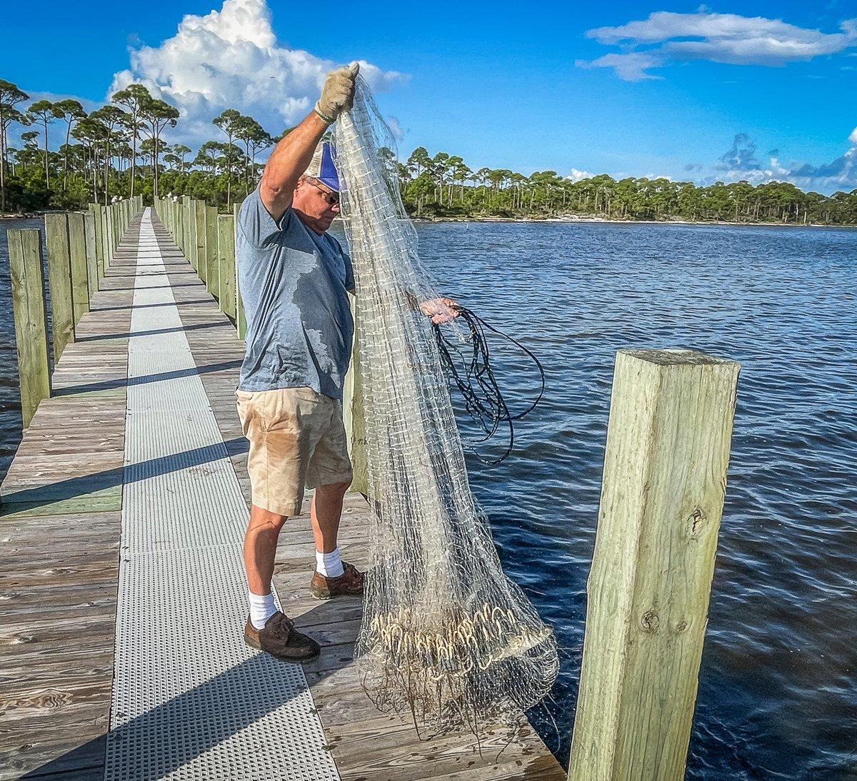 Apalachicola native Rusty Crum knows when and where to throw a net for fat fall mullet.