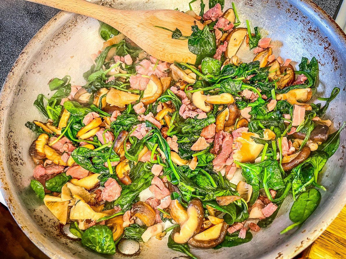 Sauté the country ham, mushrooms and spinach.
