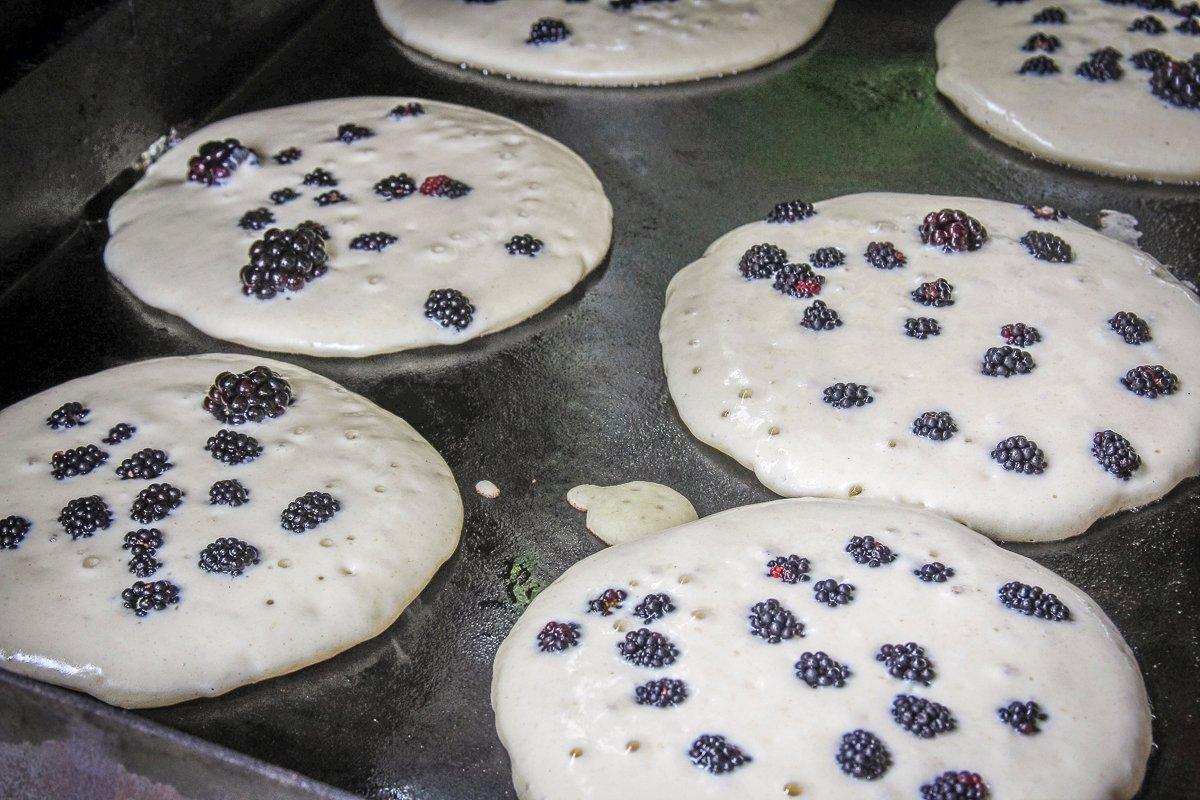 Flip the pancakes once the edges are set and tiny bubbles pop up across the surface.