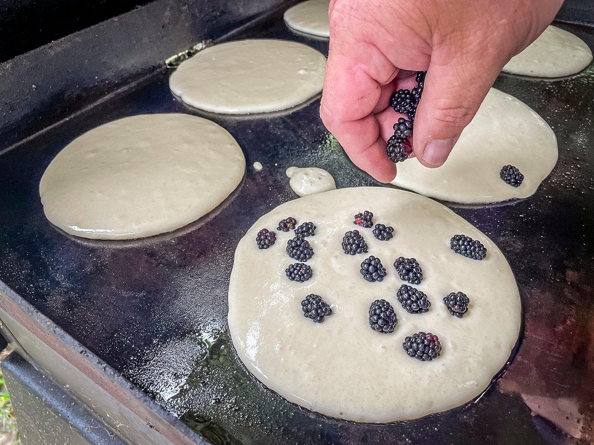 Drop the blackberries into the batter before it sets up.