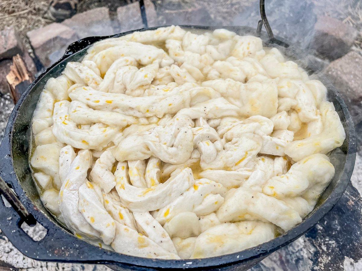 Add the dumplings to the pot and stir to blend.