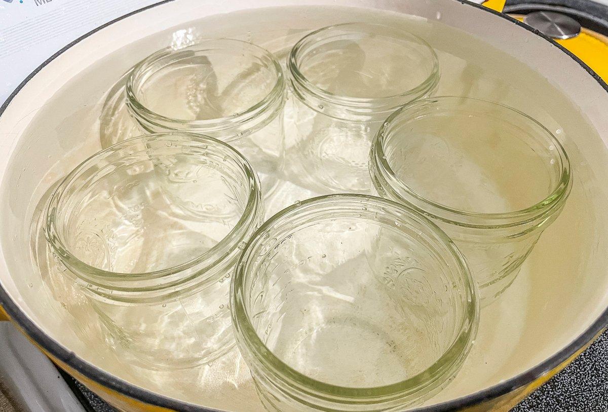 Boil the jars to sterilize them.