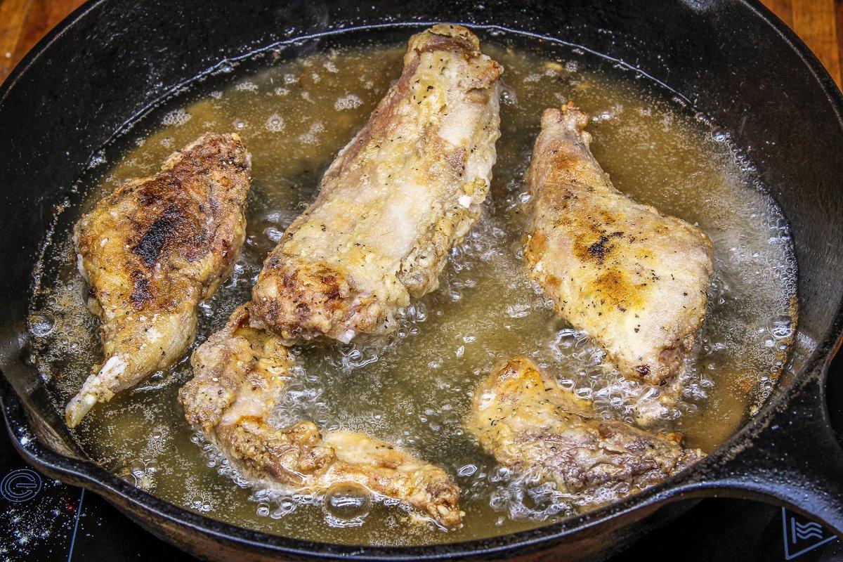 Fry the rabbit in in a cast-iron skillet with Crisco shortening.