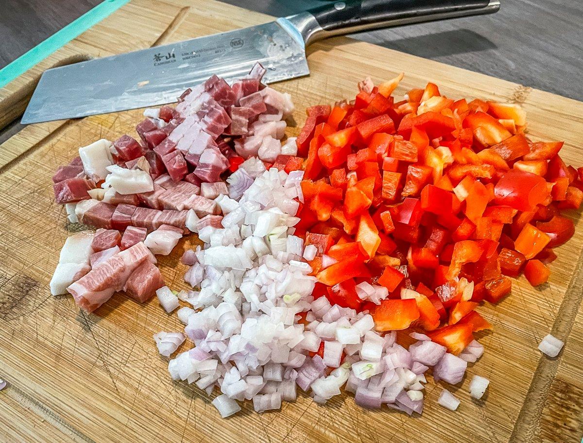 Bell peppers, shallots, and diced prosciutto are the base for the sauce.
