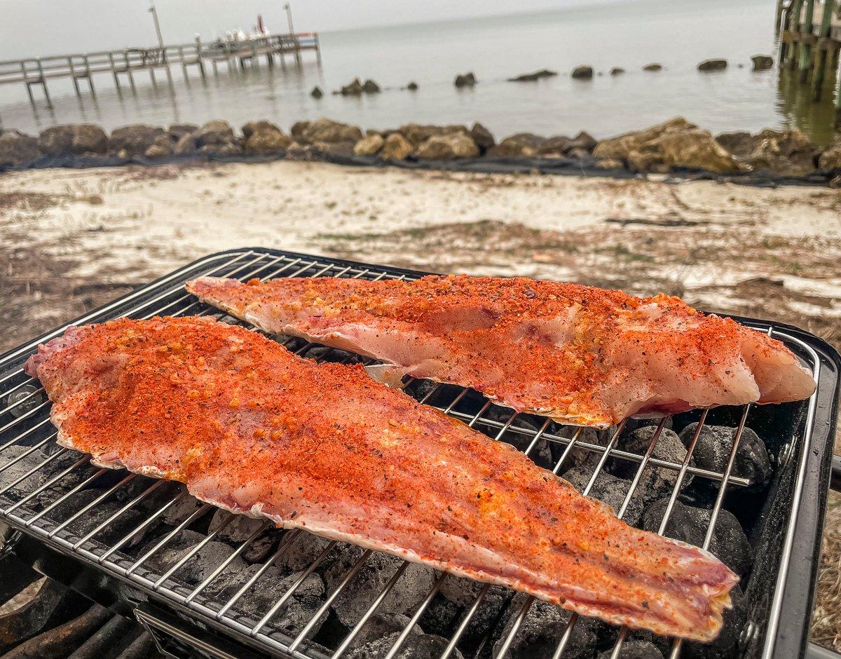 Grill the fish skin side down over medium heat.