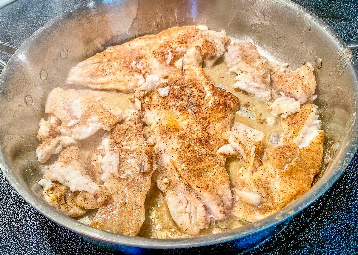 Cook the fish until it just starts to flake apart.