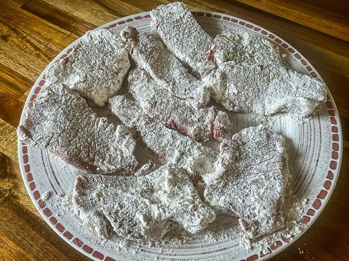 Dredge all of the backstrap before frying the slices.