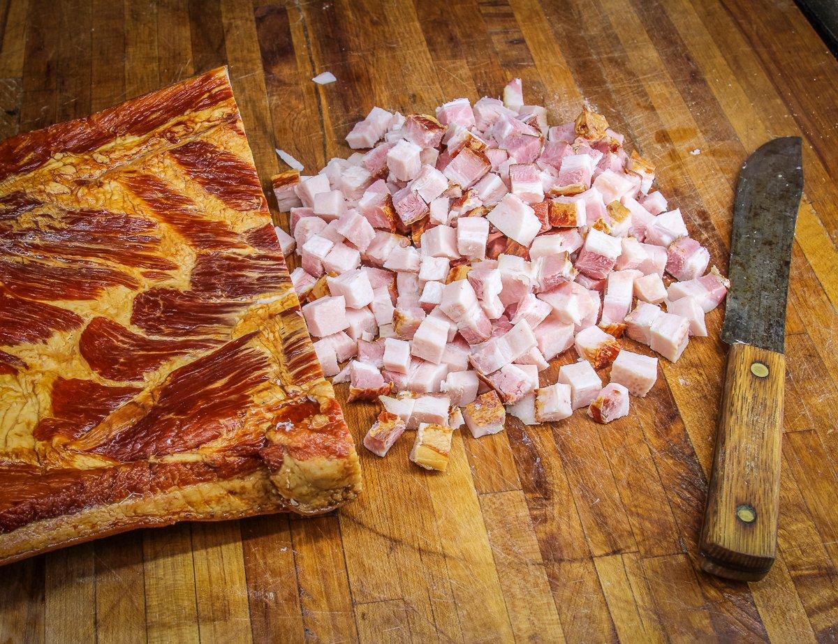 Dice the bacon, either from a store or home cured, into small bits.