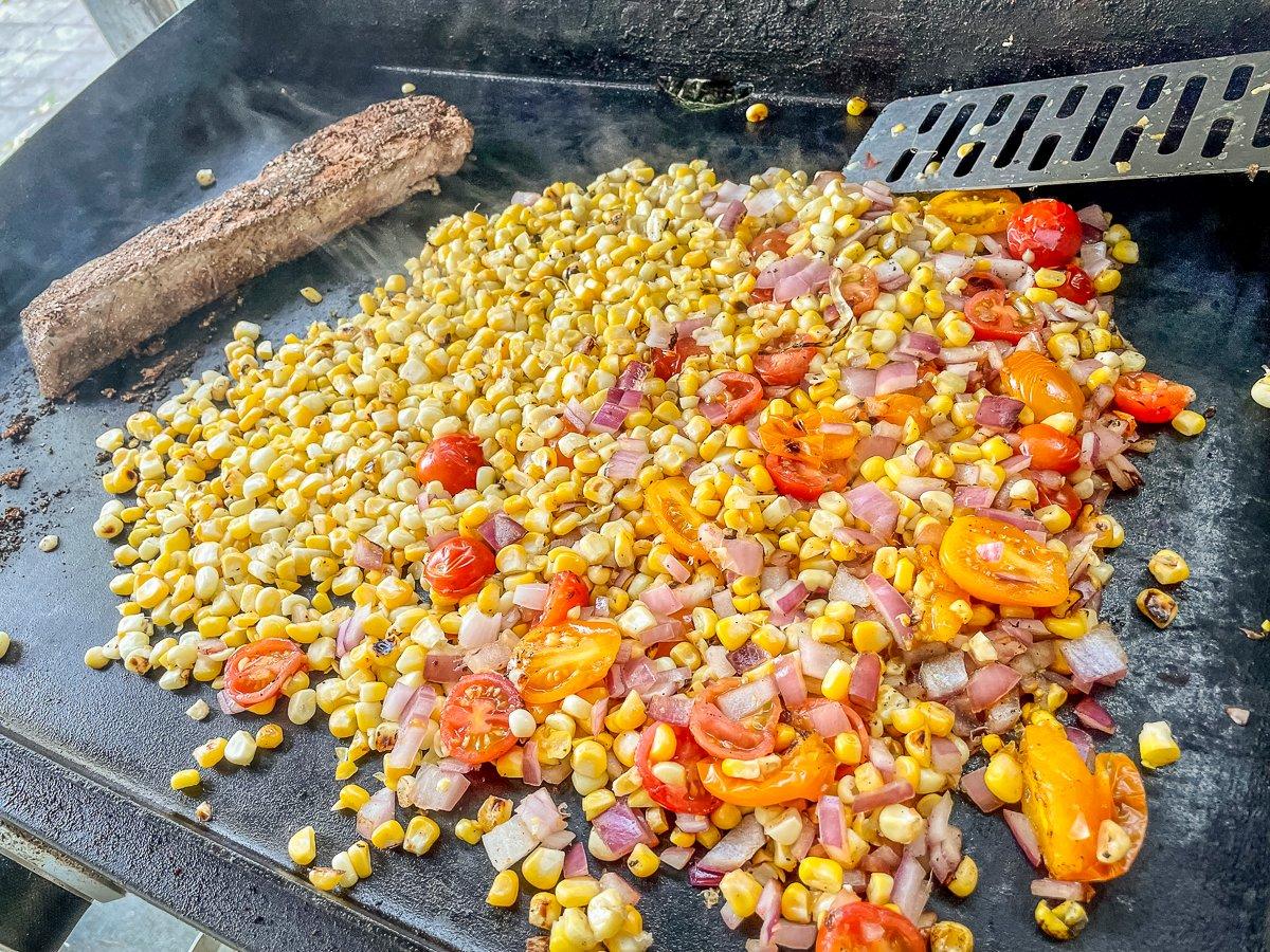 Sear the backstrap and corn mixture in a skillet or on an outdoor griddle. 