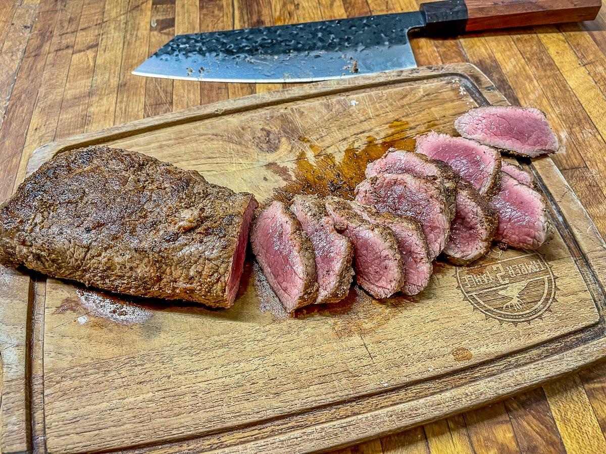 Rest the backstrap, then slice thinly against the grain.
