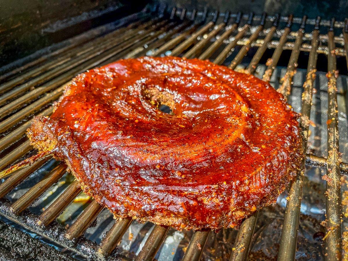 Brush the rattlesnake with sauce as it grills.