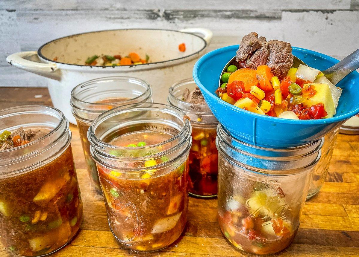 Use a canning funnel to add the soup to pint or quart jars.