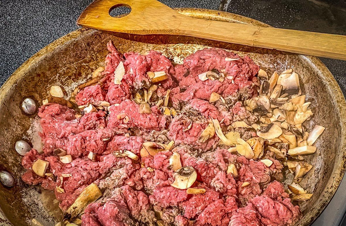 Brown the venison with the mushrooms.