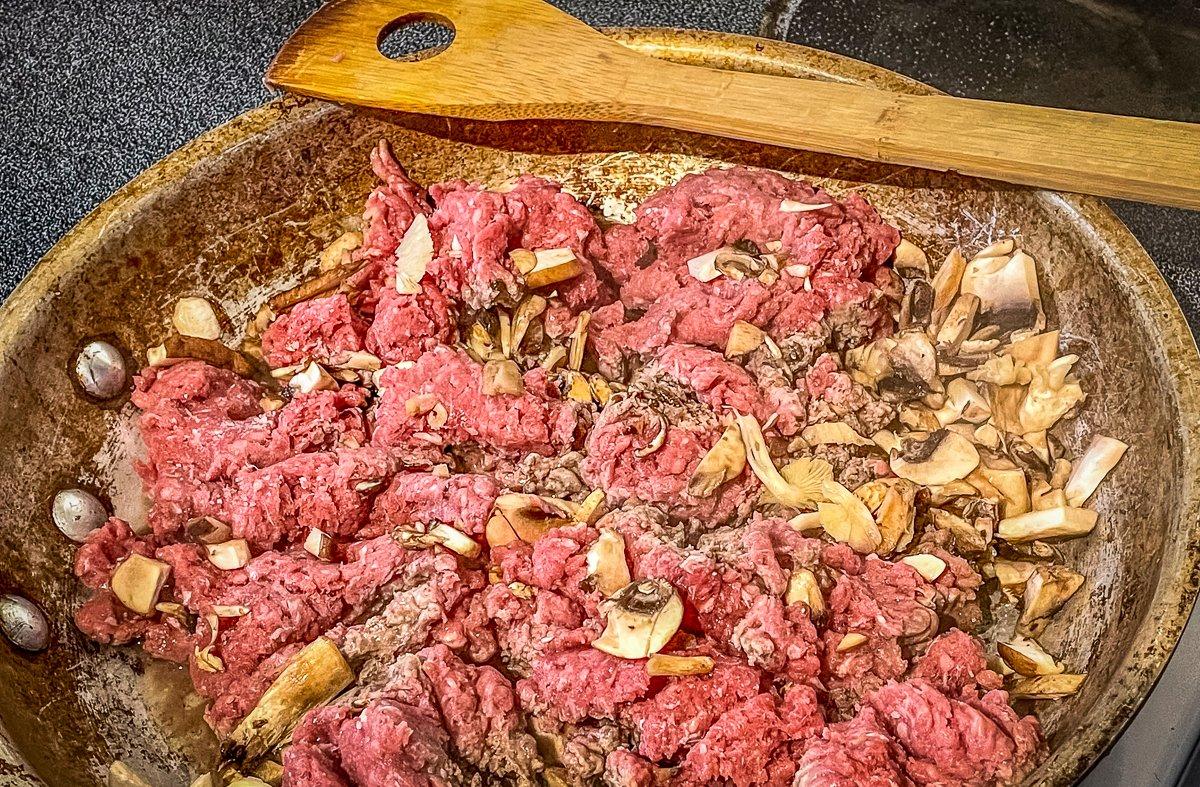 Brown the venison with the mushrooms.