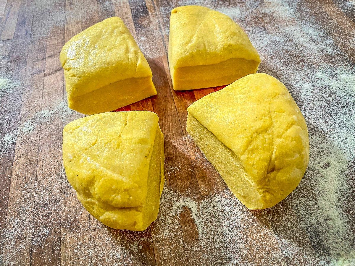 Divide the chilled pasta dough and work with one section at a time.