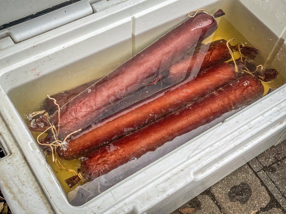 Once the sausage has reached desired temperature, submerge in ice water to stop the cooking process.