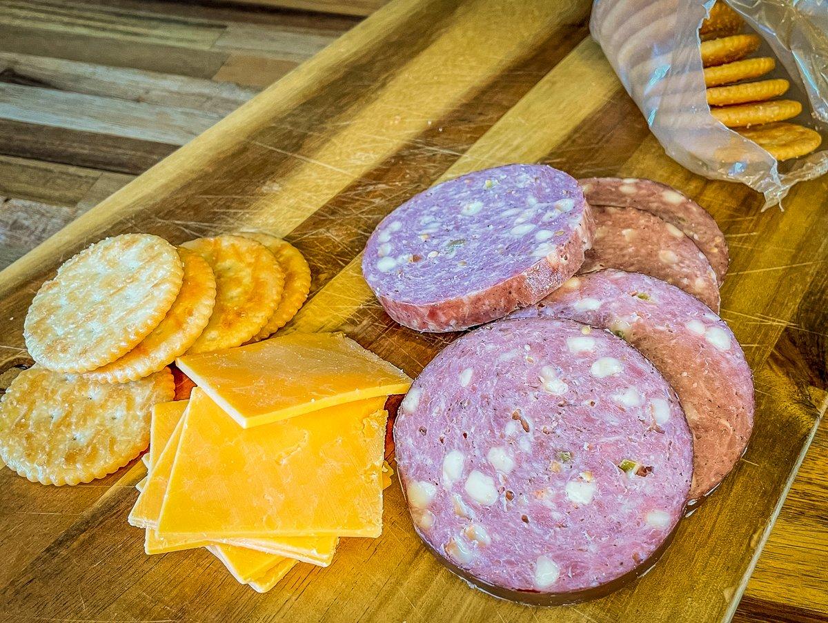 There is no better deer or turkey blind snack than a few slices of sausage, some crackers and cheese.