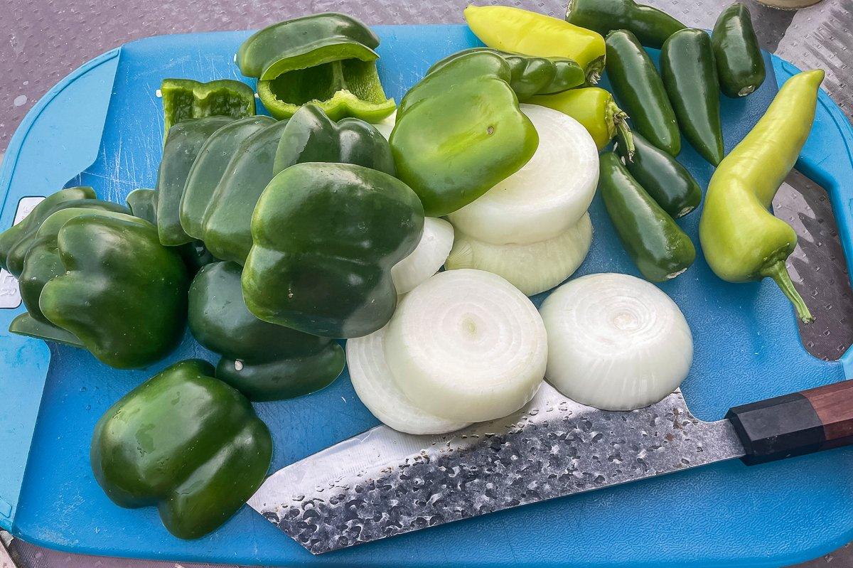 Prep the peppers and onions for the fire.