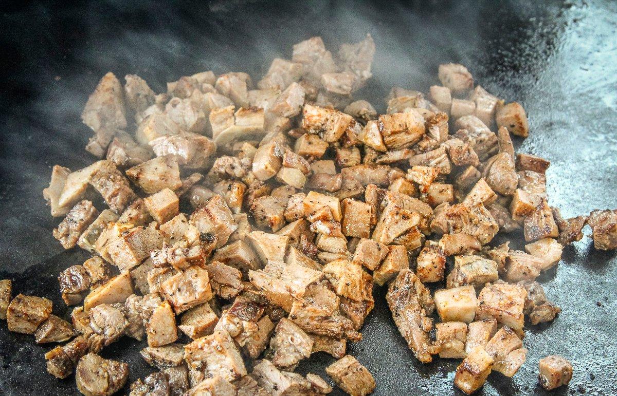 Dice the peeled tongue and sear on a griddle or cast-iron skillet.