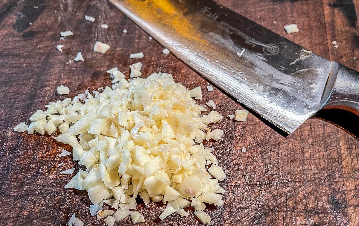 Chop fresh garlic into small bits.