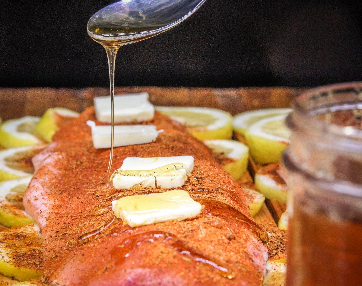 Top each fillet with 4 pats of butter and a drizzle of honey.