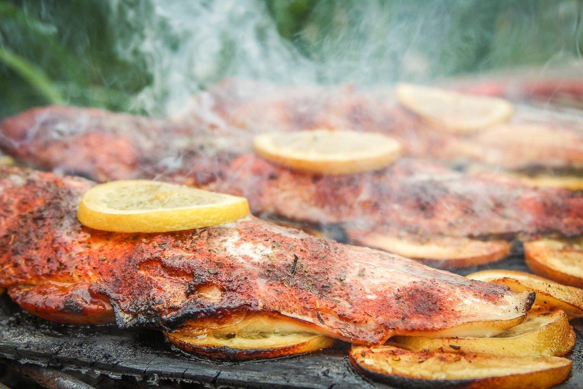 Grill the lake trout fillets until they flake apart easily in the thickest section.