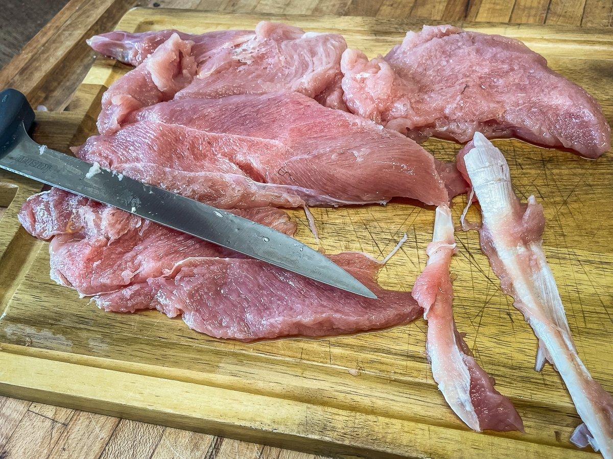 Remove the connective tissue from the tenderloins.