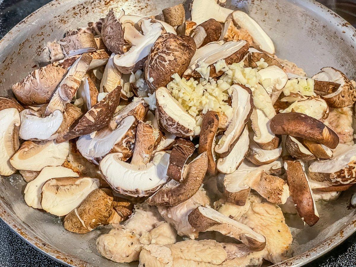 Brown the turkey, then add the sliced mushrooms.