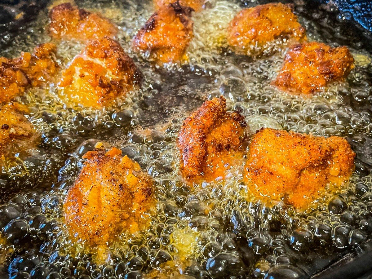 Fry the nuggets until the coating is crispy and golden brown and the meat is just cooked through.