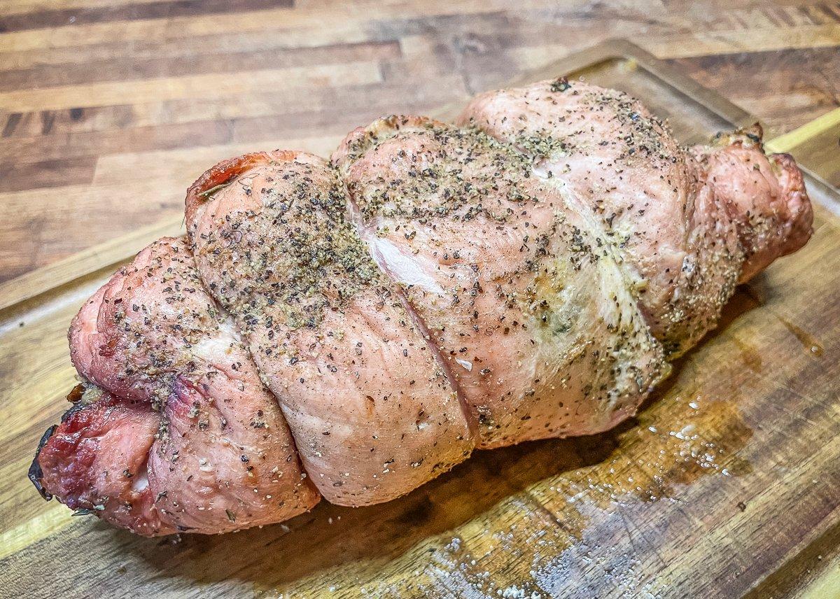 Roll the breast around the stuffing, then tie with butcher's twine before grilling.