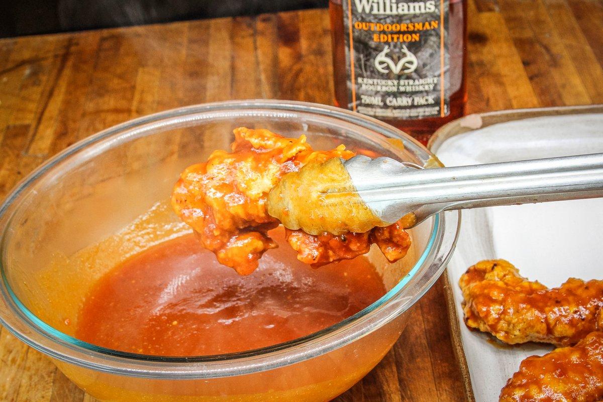 Dip the fried tenders into the warm BBQ sauce to completely coat the surface once you're ready to eat.