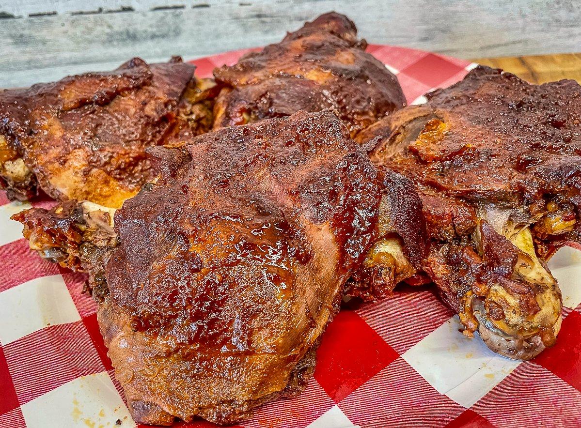 The braising process tenderizes the tough thigh meat.