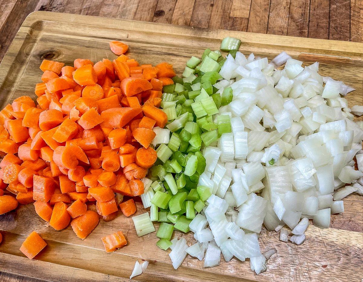 Prep the vegetables for the soup.