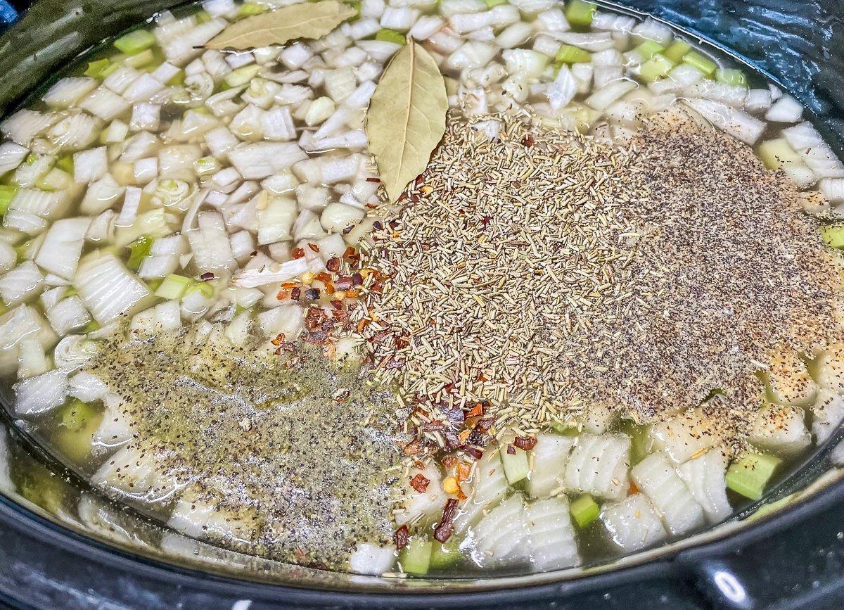 Add all ingredients but the lemon juice, pasta, and fresh parsley to the slow cooker.