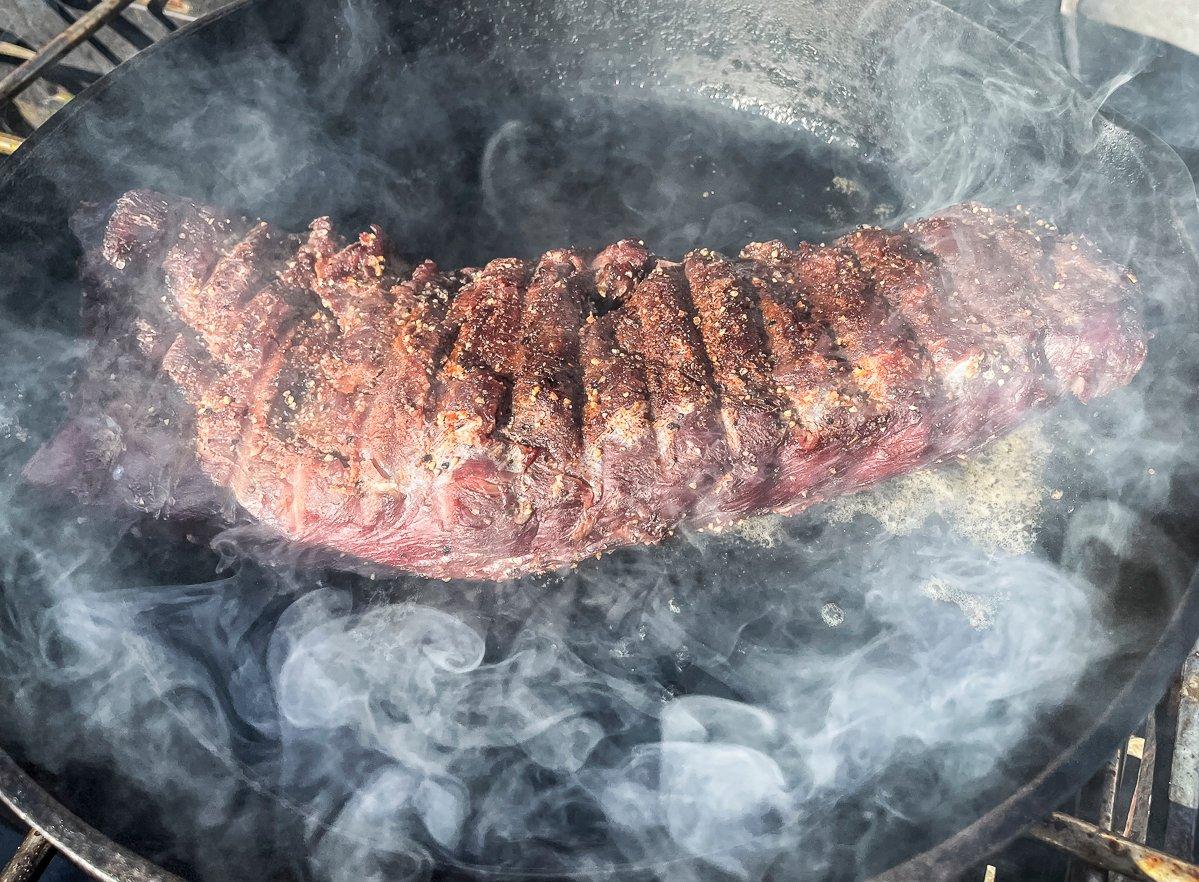 Pan-searing the backstrap outdoors keeps the unavoidable smoke out of the kitchen.