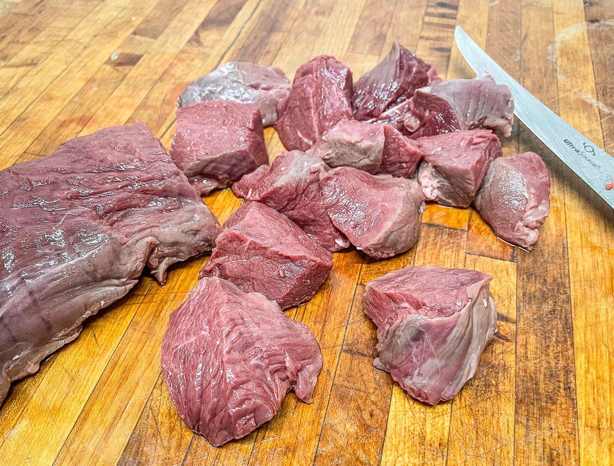 Cut the backstrap into roughly 1-inch cubes.